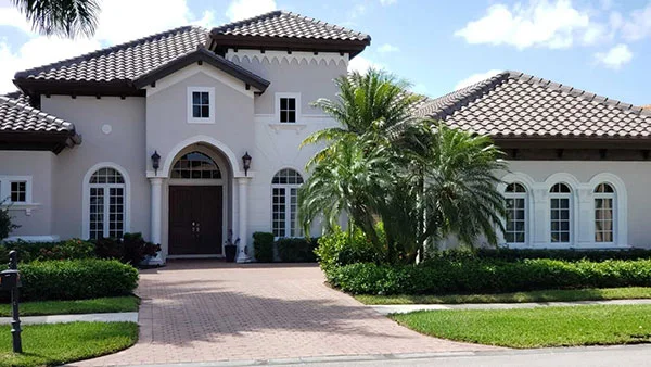 Two-story home with tile roof
